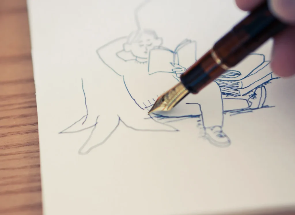 落ち葉の上で読書する男性１