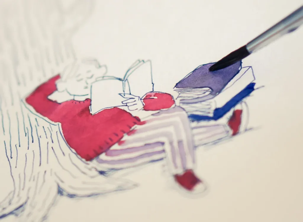 落ち葉の上で読書する男性２